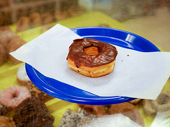 chocolate donut, sitting, blue, plate, shop., bakery, breakfast, calories, chocolate, colorful, dessert